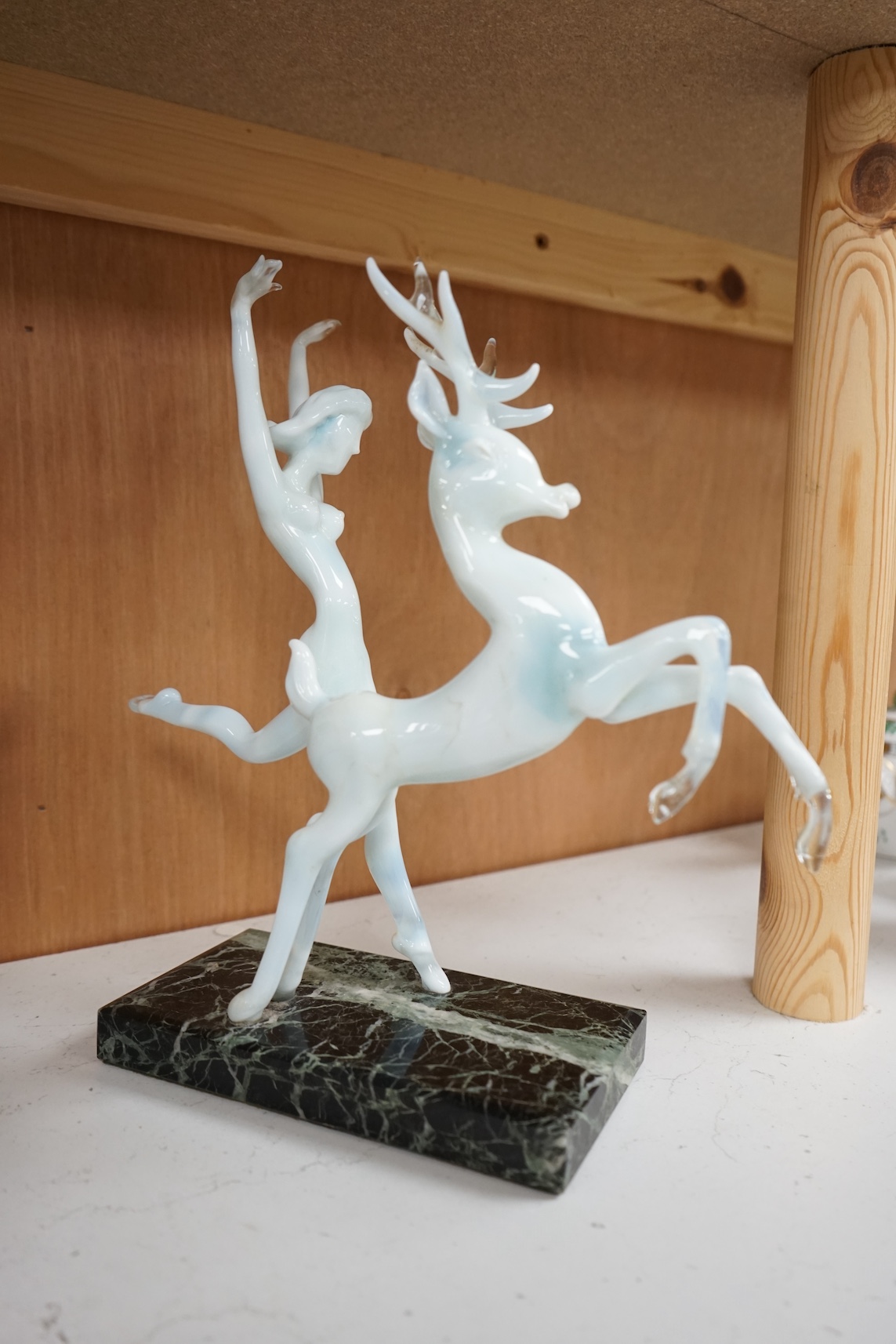 Two Istvan Komaromy glass sculptures, 1950s , one with a dancing lady and stag the other of a deer on a ball, together with a group of three later art glass dishes, tallest 26cm high., Condition - foot to deer on ball ch